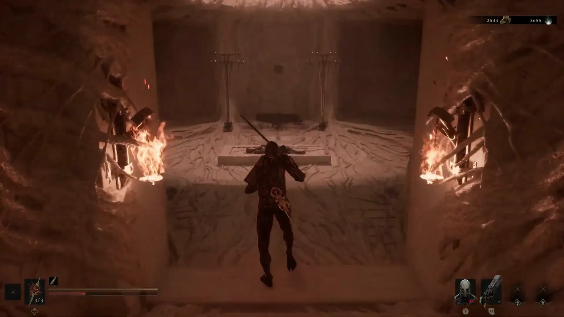 The player approaching a fallen Shell in a torch-lit chamber